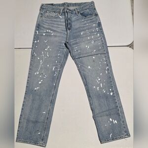 Levi's 541 Athletic Taper jeans featuring a white paint splatter
